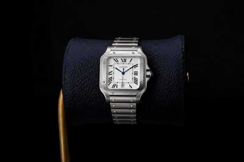 Cartier Santos de Cartier Large WSSA0018 on a leather watch cushion